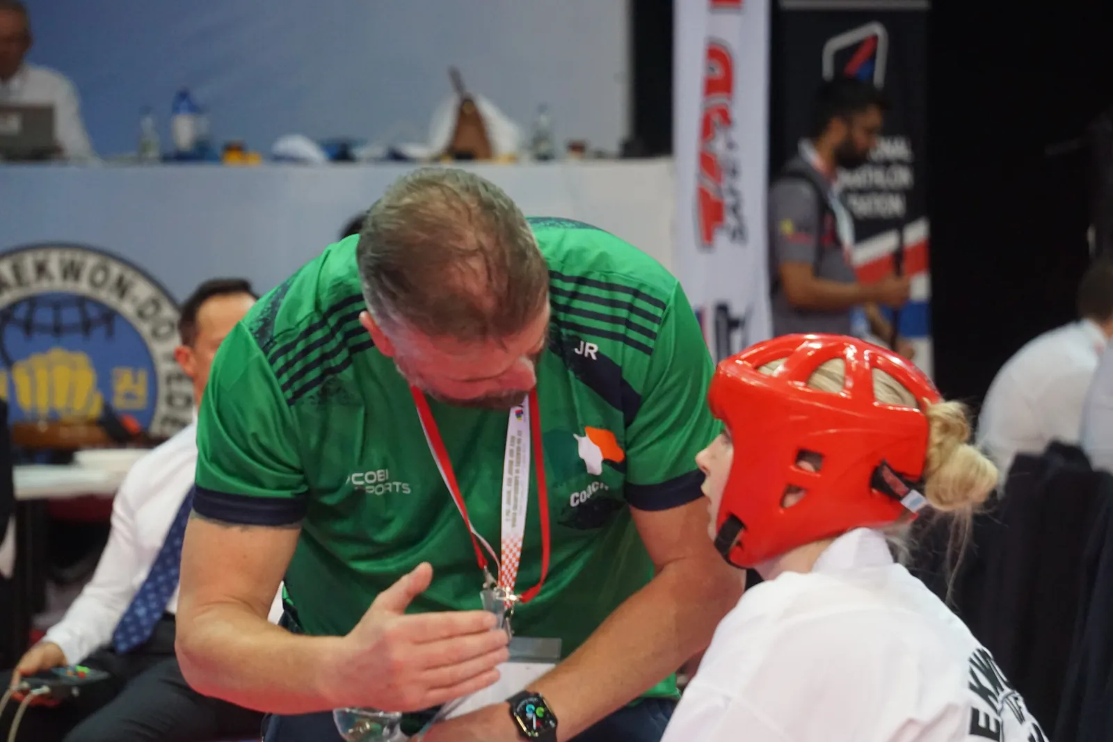 Team Ireland coach briefing an athlete between rounds