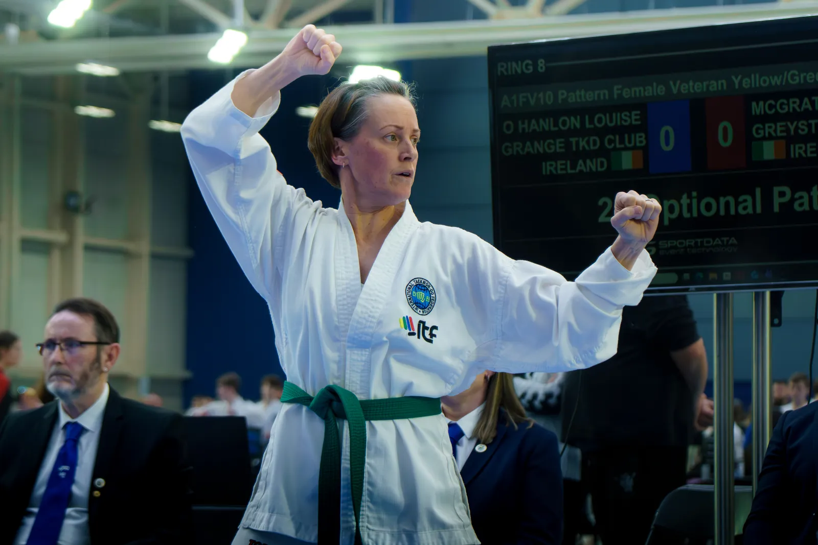 Adult member executing a rising block with focus and control