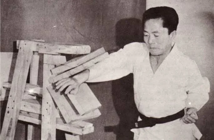 General Choi Hong Hi after a board breaking demonstration